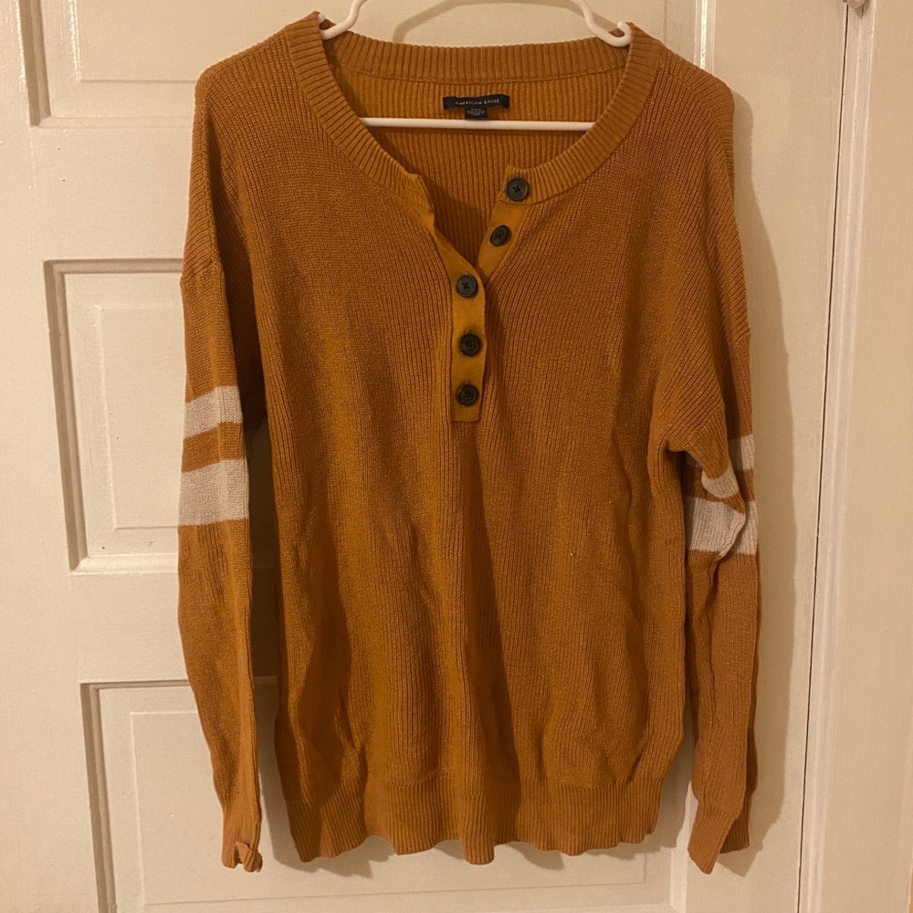 American eagle burnt orange sweater! NWOT size medium with buttons and stripes